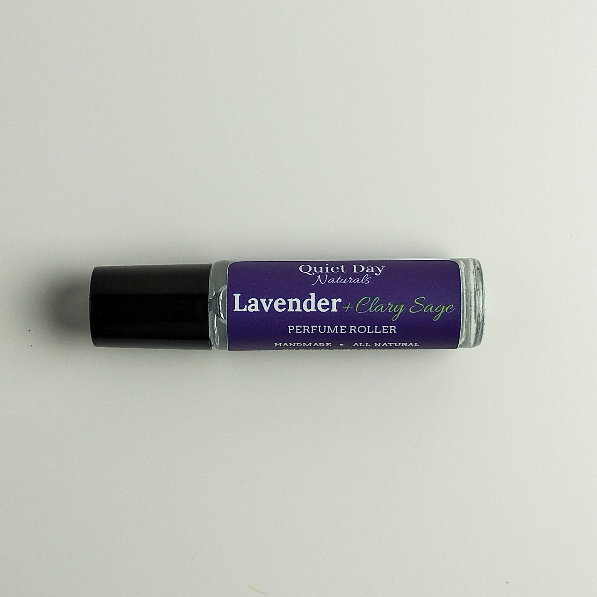 All-Natural Perfume Roller laying against a white background.