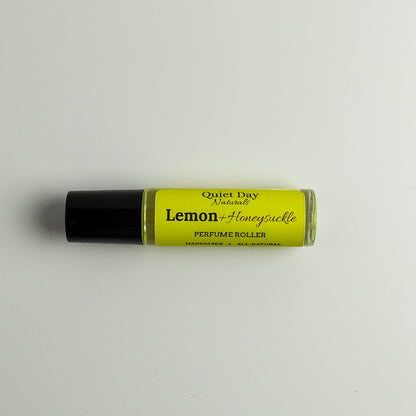 All-Natural Perfume Roller laying against a white background.